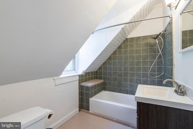 bathroom featuring shower / bath combination, toilet, lofted ceiling, tile patterned flooring, and a sink