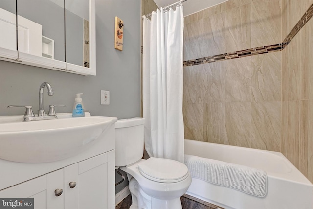 bathroom with vanity, toilet, and shower / bath combo with shower curtain