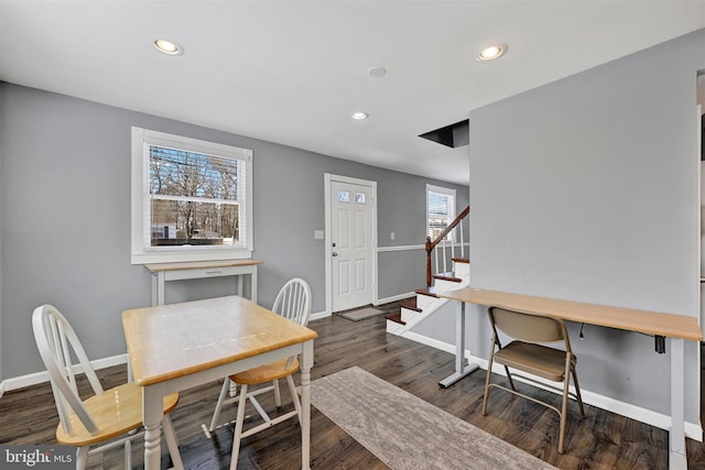 dining area featuring recessed lighting, baseboards, wood finished floors, and stairs