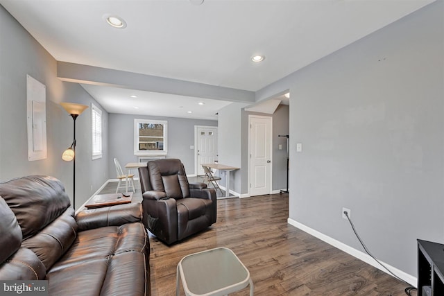 living area with recessed lighting, baseboards, and wood finished floors