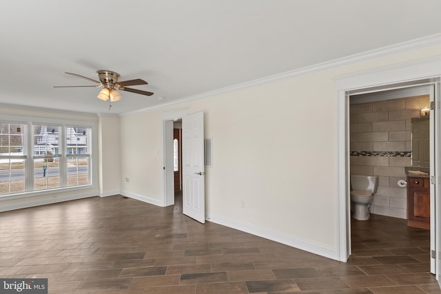 interior space featuring baseboards, ceiling fan, ornamental molding, and wood tiled floor