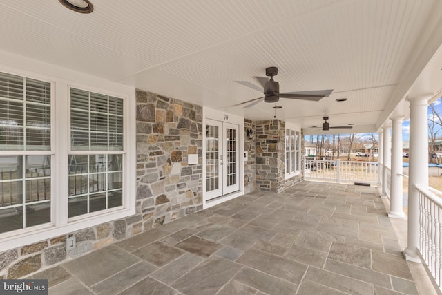 view of patio featuring ceiling fan and french doors