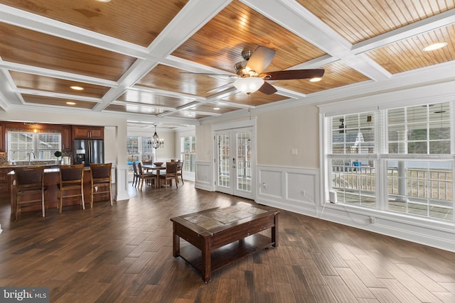 living area with wood ceiling, coffered ceiling, dark wood finished floors, and french doors