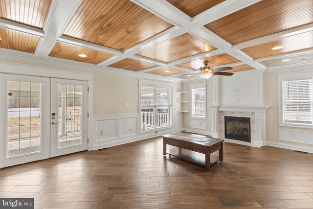 unfurnished living room featuring wood ceiling, french doors, dark wood-style flooring, and a high end fireplace