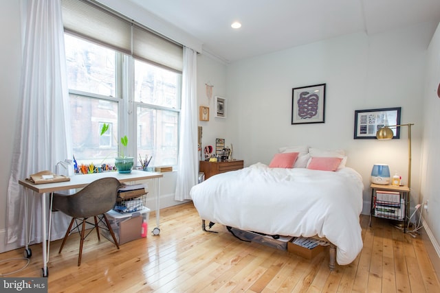 bedroom with recessed lighting, baseboards, and hardwood / wood-style floors