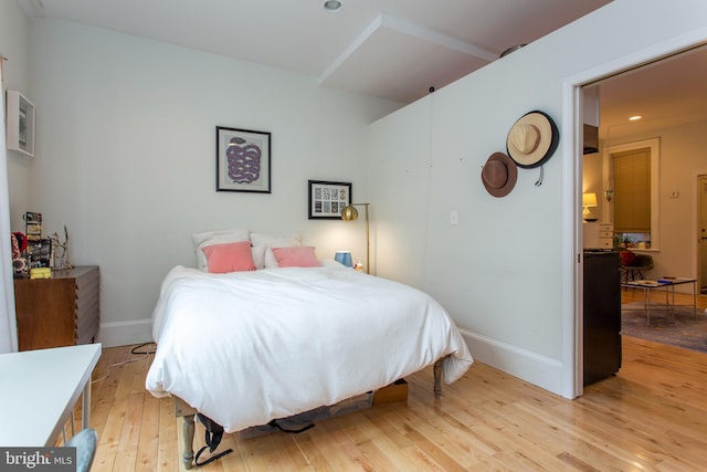 bedroom featuring recessed lighting, light wood-style flooring, and baseboards