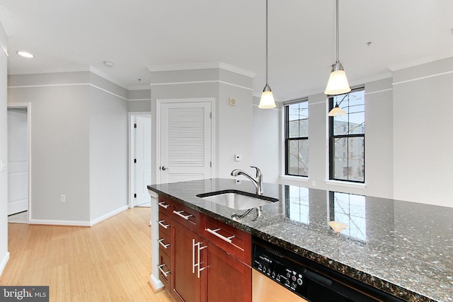 kitchen featuring ornamental molding, dishwashing machine, dark stone countertops, light wood-style flooring, and a sink