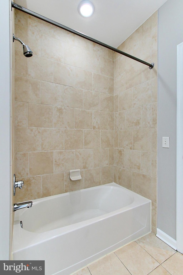 full bathroom featuring tile patterned floors and bathing tub / shower combination