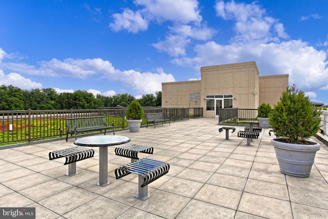 view of patio featuring fence