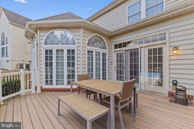 wooden deck featuring outdoor dining space