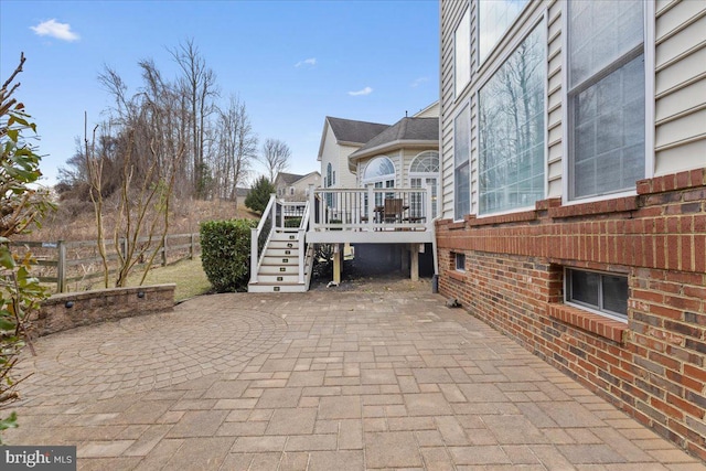 view of patio featuring stairs and a wooden deck