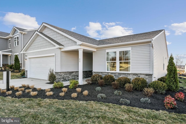 craftsman house with a garage, stone siding, a shingled roof, and concrete driveway