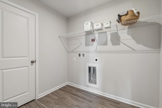 laundry room with hookup for a washing machine, electric dryer hookup, wood finished floors, laundry area, and baseboards