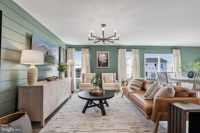 living room featuring an inviting chandelier and wood finished floors