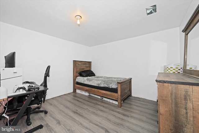 bedroom with wood finished floors