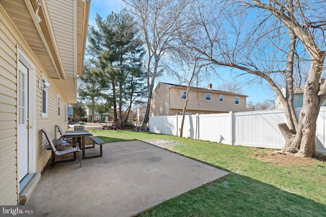 view of yard featuring a patio and fence