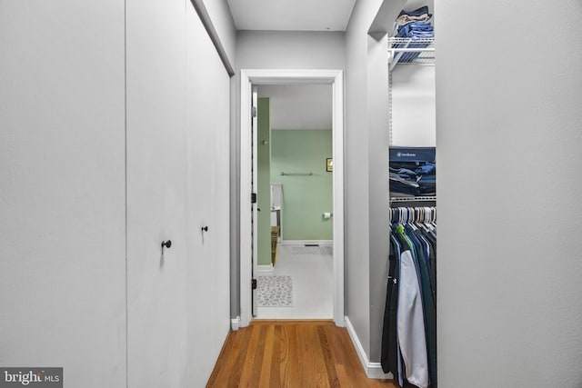 interior space featuring wood finished floors and baseboards