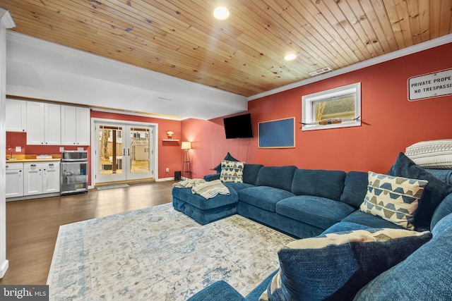 living room with dark wood finished floors, wooden ceiling, and crown molding