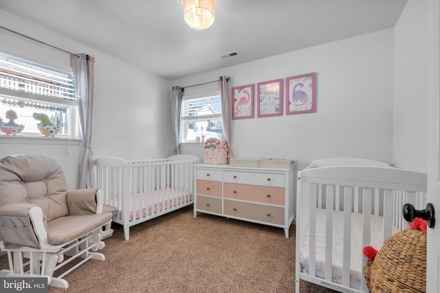 carpeted bedroom with visible vents