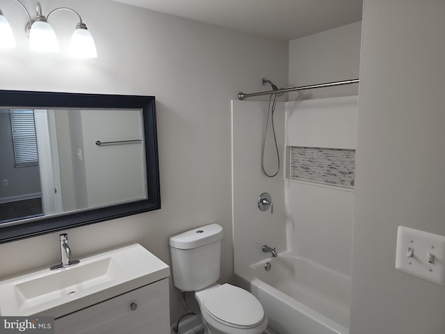 bathroom with toilet, vanity, and  shower combination