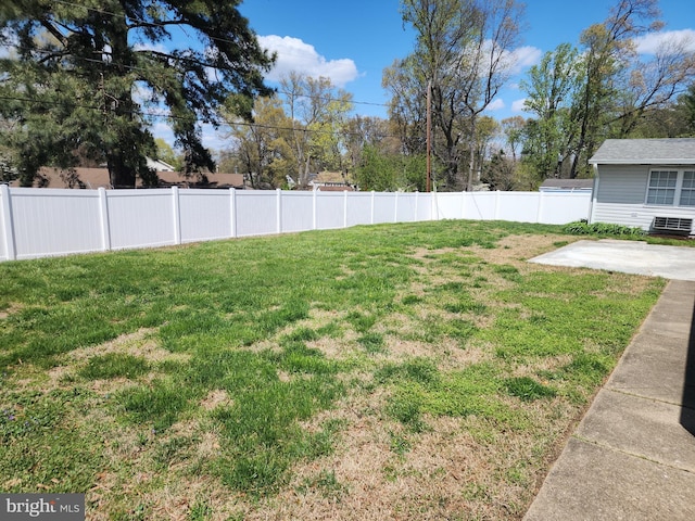 view of yard with a fenced backyard and a patio