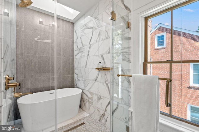 full bath featuring a shower stall, tile walls, and a freestanding bath