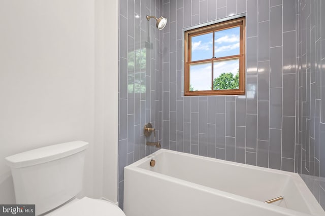 bathroom featuring toilet and shower / bathing tub combination