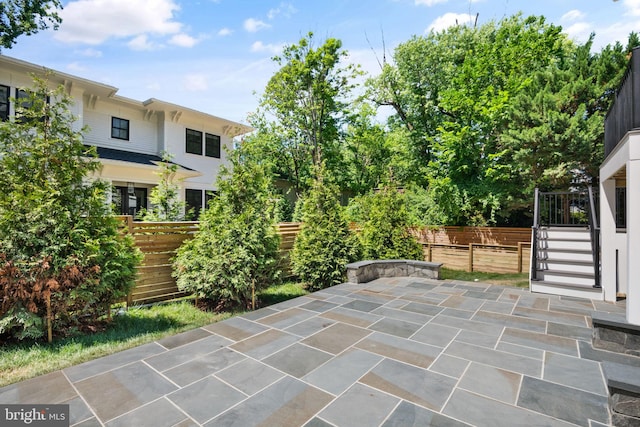 view of patio featuring fence