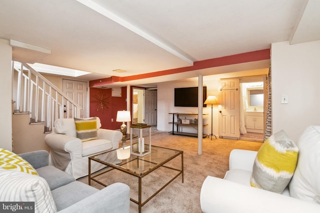 carpeted living room featuring stairway