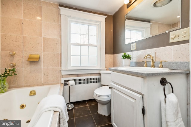 full bathroom featuring tile patterned flooring, toilet, radiator heating unit, a whirlpool tub, and tile walls