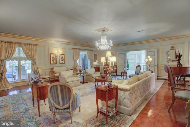 living room featuring a chandelier, a decorative wall, and ornamental molding