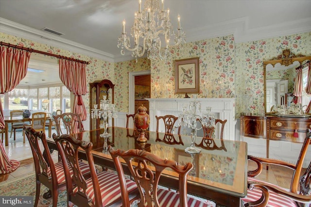 dining space with wallpapered walls, a notable chandelier, visible vents, and crown molding