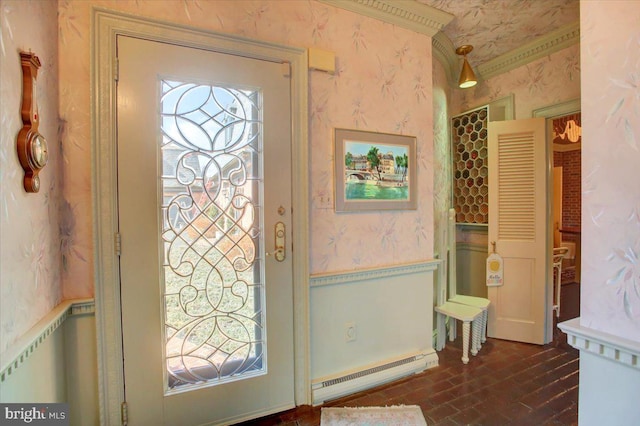 entrance foyer featuring brick floor, wallpapered walls, baseboard heating, and a wainscoted wall