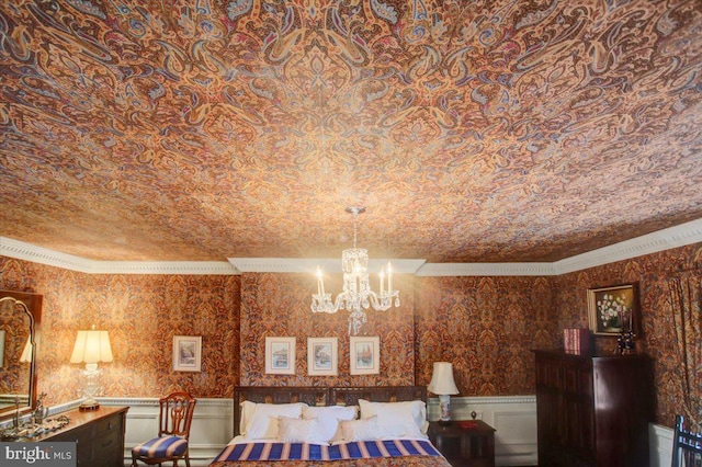 unfurnished bedroom with wallpapered walls, an inviting chandelier, crown molding, and wainscoting