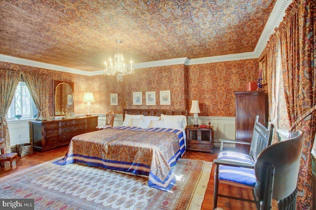 bedroom featuring a decorative wall, a wainscoted wall, a notable chandelier, ornamental molding, and wallpapered walls