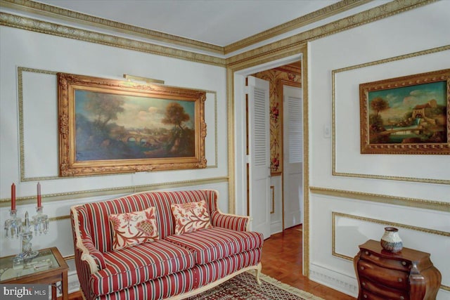 living area featuring ornamental molding