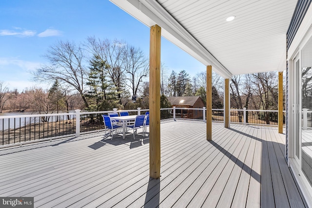 deck with outdoor dining area