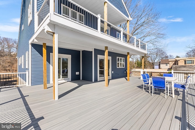 wooden deck with outdoor dining space