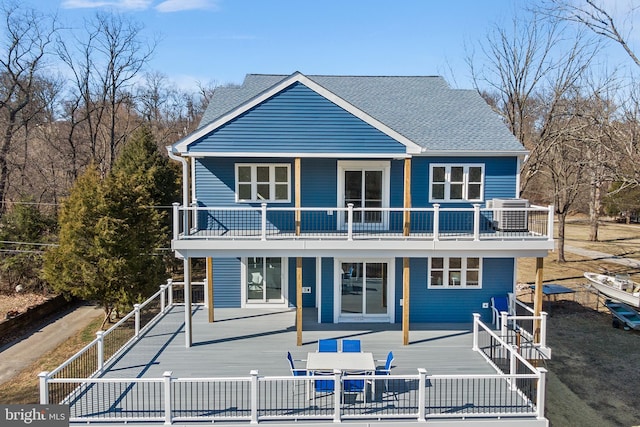 back of house with roof with shingles, fence, a patio, and central AC unit