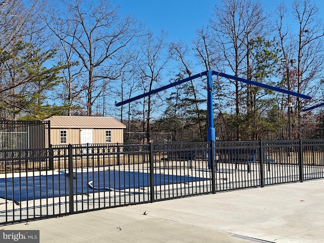 view of pool with an outdoor structure and fence