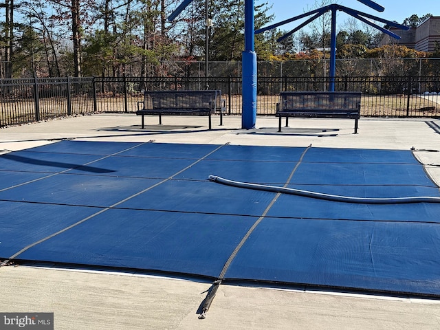 view of sport court with fence