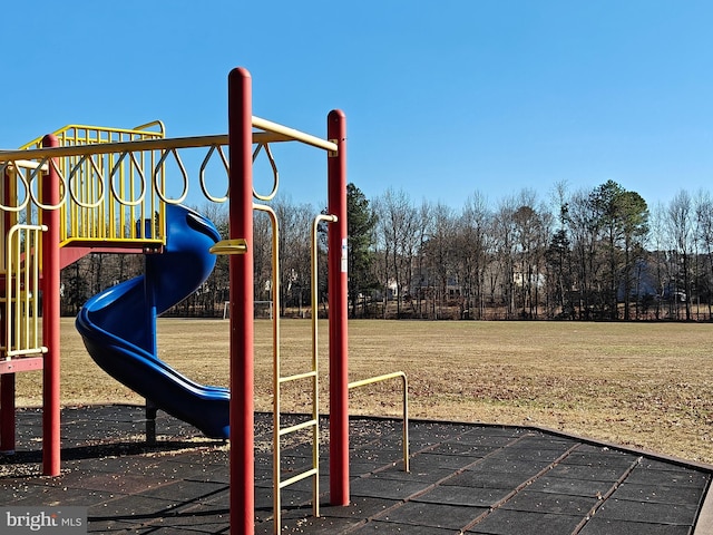 community playground featuring a lawn