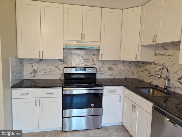 kitchen featuring appliances with stainless steel finishes, a sink, white cabinets, and under cabinet range hood