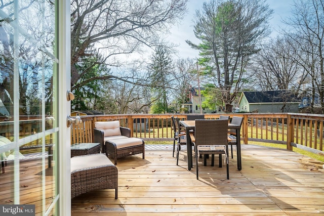 deck with outdoor dining area