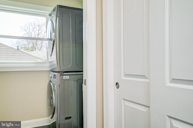 washroom with laundry area and stacked washing maching and dryer