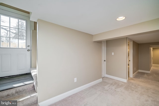 basement with recessed lighting, baseboards, and light carpet