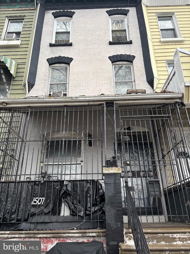 view of building exterior with a fenced front yard