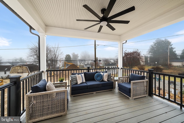 deck with a ceiling fan and outdoor lounge area