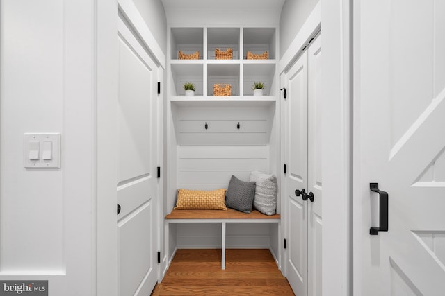 mudroom with wood finished floors