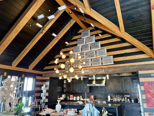 bar featuring beam ceiling, backsplash, wall chimney range hood, a chandelier, and wooden ceiling